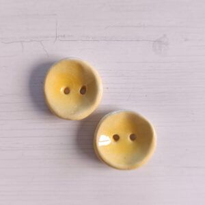 2 botones 2.5cm Amarillo